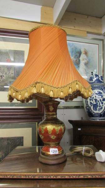 An oriental style table lamp with shade.