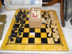 A large chess set (black queen missing)