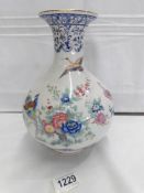 A nice porcelain vase hand decorated with birds and flowers.