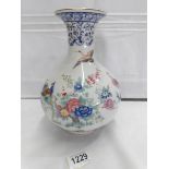 A nice porcelain vase hand decorated with birds and flowers.