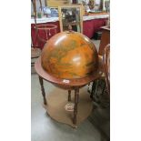 A globe shaped drinks cabinet.