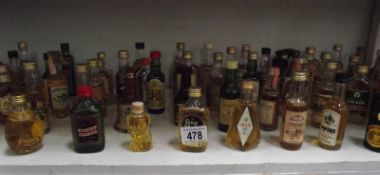 50+ miniature bottles of whisky,