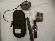 A military issue CWC quartz wrist watch, a compass and a Yorkshire regiment match holder.