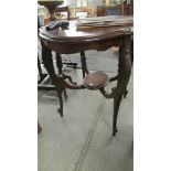 A mahogany occasional table.