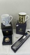 A boxed Royal Worcester 250th anniversary mug, a boxed Millennium mug,