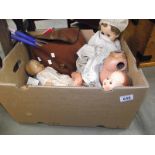 A box of vintage dolls etc.