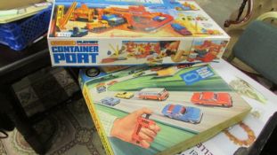A boxed Matchbox M1 motorised motorway and a container port.