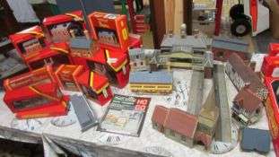 A good lot of boxed and unboxed model railway buildings.