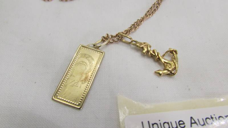 A 14k gold pendant of Madonna & Child on chain with unmarked anchor, total weight 7.5 grams. - Image 2 of 2