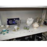 A mixed lot including cherub figures some a/f. Tea cups and saucers etc.