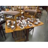 A teak drop leaf table with 4 chairs.