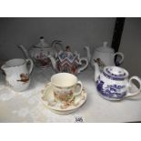 A collection of teapots including Doulton, Bunnikins, nursery ware etc.