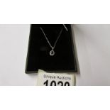 An 18ct white gold sapphire and diamond pendant necklace of 30 points.