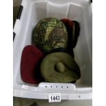 A military helmet, caps and berets etc.