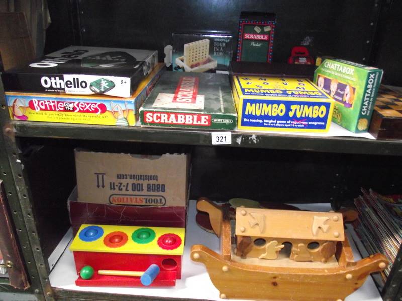 2 shelves of old games including wooden Noah's ark.