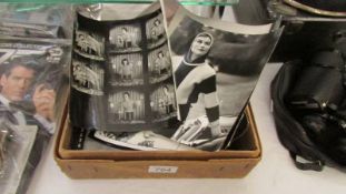 A box of vintage photographic contact sheets and negatives relating to knitware design and some