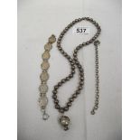 A George V silver threepenny bit bracelet, a necklace and another bracelet.