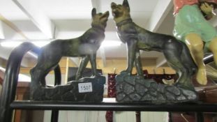 A pair of Alsation dog figures.