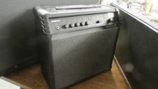 A Spider V60 guitar amplifier with mains lead and jack to jack lead, in good condition.