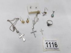 A mixed lot of jewellery including cross pendants, earrings etc.