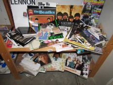 2 shelves of Beatles memorabilia.