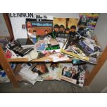 2 shelves of Beatles memorabilia.