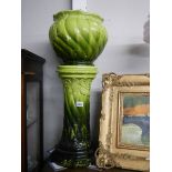 A Victorian Bretby style green jardiniere on stand.