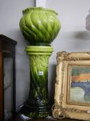 A Victorian Bretby style green jardiniere on stand.