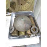 A quantity of Grandfather clock weights and a bell.