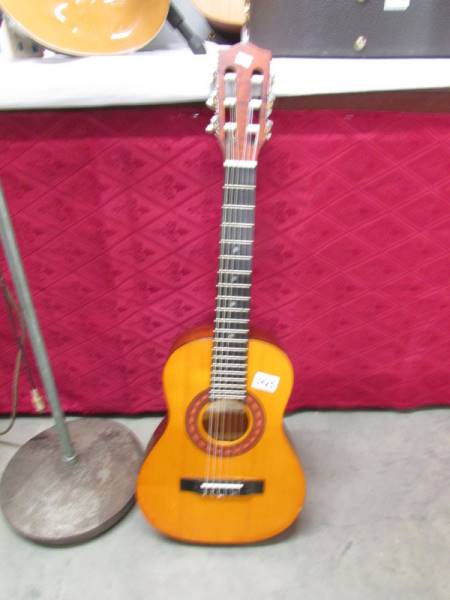 An Encore Enczon Spanish guitar with soft case, in good condition.