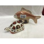 A Royal Crown Derby fish with gold stopper and a Royal Crown Derby tortoise with no stopper.