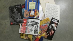 A large lot of guitar tuition books including an Ernie Ball and Harmonica.