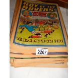 A quantity of Roy of the rovers comics