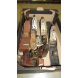 A box of old woodworking planes.