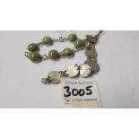 A silver bracelet set probably epidote stones with what looks like a Dublin 1967 hall mark together