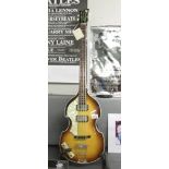 A left handed Hofner "Beatle Bass" guitar with original hard case (new old stock).