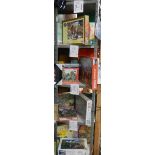 4 Shelves of jigsaw puzzles, approximately 24,