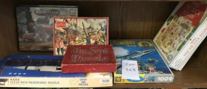 A selection of vintage jigsaws including Stingray, Nasa panoramic puzzle etc.