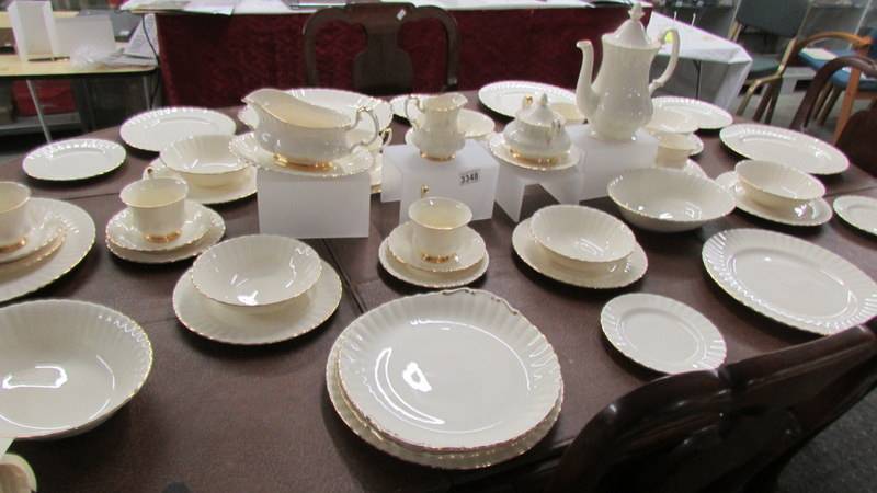 Approximately 54 piece of Royal Albert affinity gold pattern tea and dinner ware.