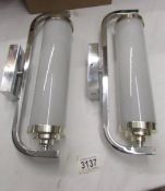 A pair of chrome art deco style wall lights.