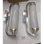 A pair of chrome art deco style wall lights.