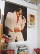 An Elvis poster and an Elvis 1981 calendar.