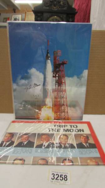 A signed photograph of astronaut John Glenn and Trip to the Moon publication.