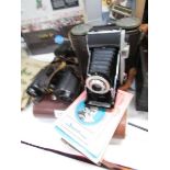 2 pairs of binoculats including Carl Zeiss, a Kodak Juniior II camera and 2 vintage camera books.