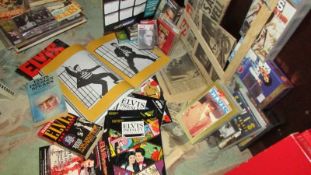 A comprehensive collection of Elvis memorabilia including original newspapers, comics etc.