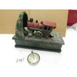 A vintage railway timekeeper pocket watch and a cast iron Orient Express money box, both a/f.