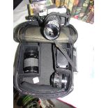 A Minolta X300 camera with lenses.
