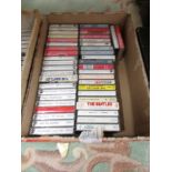 Approximately 40 Beatles cassette tapes.