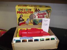 A Chad valley Give-A-Show projector in box complete with slides, Walt Disney, Jungle Book etc.