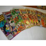 A quantity of Justice League America comics